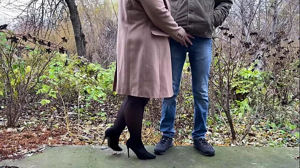 StepMother-in-law in leather skirt and heels holds son-in-law's dick while he pees