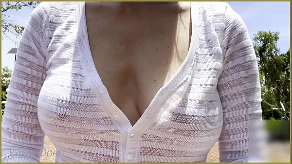 Walking to the beach in a braless shirt
