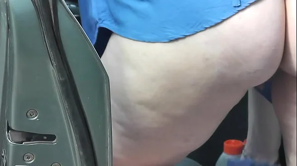 In dressing gown without panties pretty sexy blonde Milf Frina cleans interior of her car in courtyard of house. No panties in public. Nude in public. Public exposure. Public nudity. Publicly. Naked in public. Solo MILF. Outdoor. Outside. No panties. Ass