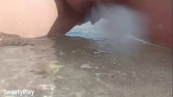 Shaved pussy peeing on public beach