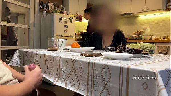 My husband jerking under a table front of my step mom and i right at the kitchen.