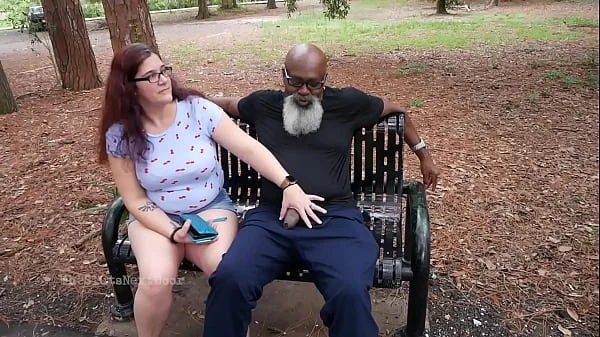 Nerdy Milf strokes and suck blk dick in the Park