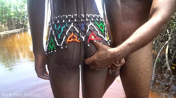 Journalist came to film an African tribe ended up getting his cock ridden by a horny ebony village girl in the water