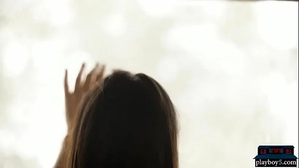 Perfect brunette babe gives a striptease and poses