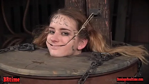 Bdsm babe trapped in a barrel and electrified
