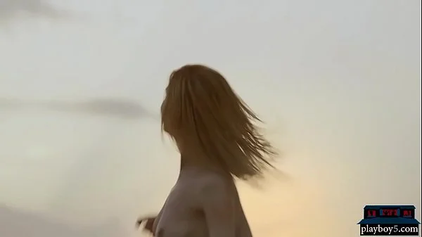 Four lesbian girlfriends enjoy each other on the beach