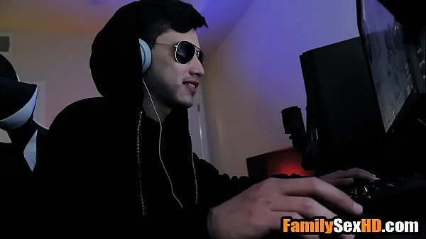 Stepsister fucks stepbrother while he is playing video games