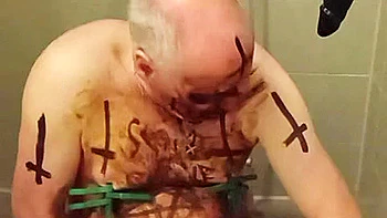 Satan slave takes perverted enema treatment