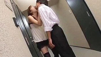 She licks him while he's naked, and swallows his semen into her mouth.