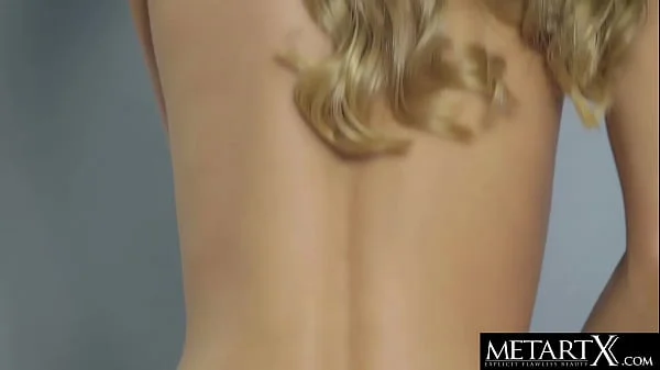 Stunning blonde caresses her perfect breasts as she masturbates