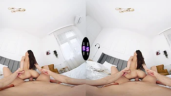 A long-haired brunette with natural tits fucks in missionary position