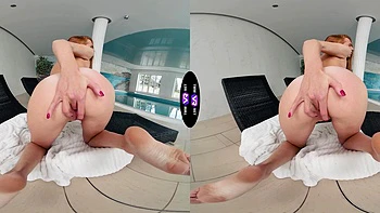 A cute and sweet red-haired girl named Holly Molly plays with her pussy.