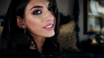 A couple enjoys a passionate moment with a stunning brunette