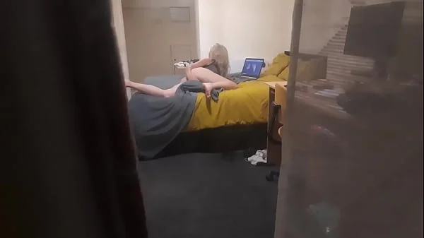 Girl caught masturbating through the window