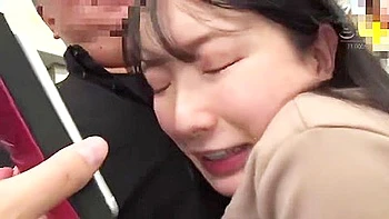 On the train, she is surrounded by men, groping her body and being penetrated deep in her throat.