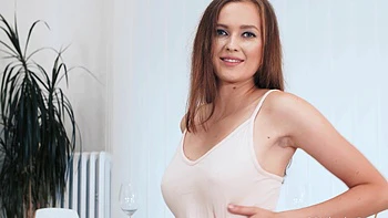 Stacy Cruz in sexy stockings and garter, teasing with her big natural tits.