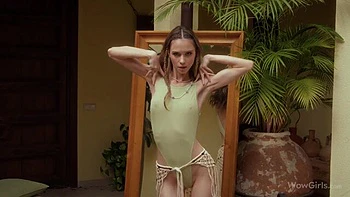 Skinny and young hottie Leona Mia is touching her shaved pussy