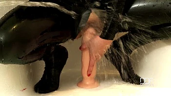 Bartroom dildoing in latex