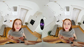 A beautiful freckled redhead girl in reverse cowgirl position