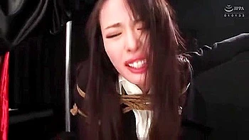 She is hit with a vibrator, fingered, and has a vibrator inserted and removed until she cums.