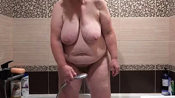 MILF with Big Tits and Hairy Pussy Takes Off Dirty Panties to Piss in Bathroom - PAWG Amateur Video