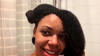 Ebony babe with big tits takes shower solo