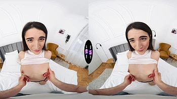 A hot brunette girl is having fun on the bed in vr